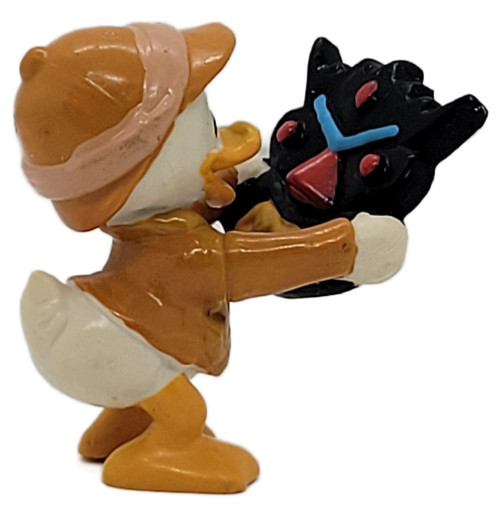 Applause Vintage 1986 Disney DuckTales Dewey Duck PVC Figurine with Tribal Mask by Applause, vintage Dewey Duck figurine wearing a brown explorer outfit and holding a black tribal mask with blue and red details, shown against a white background.