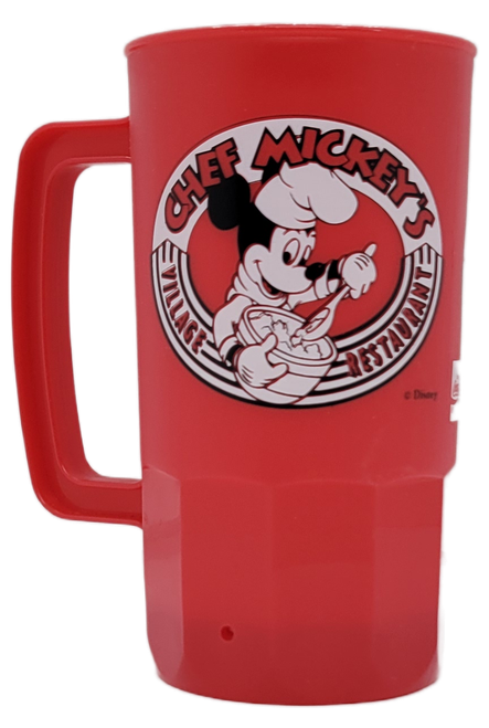 Vintage red Chef Mickey’s Village Restaurant plastic mug with Mickey Mouse chef logo and rectangular handle.