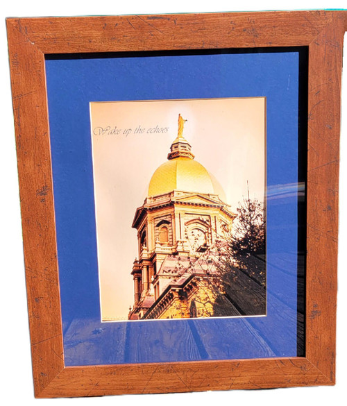 University of Notre Dame Notre Dame Golden Dome “Wake Up the Echoes” Framed Artwork – Fighting Irish Wall Decor, framed photo artwork of the iconic Golden Dome with “Wake up the echoes” lettering, blue mat, and rustic wood frame.