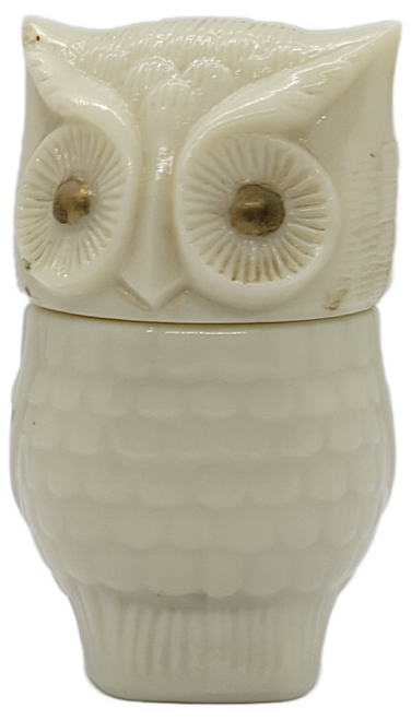 Vintage Avon Moonwind ivory owl jar with gold-tone eyes and removable head lid.