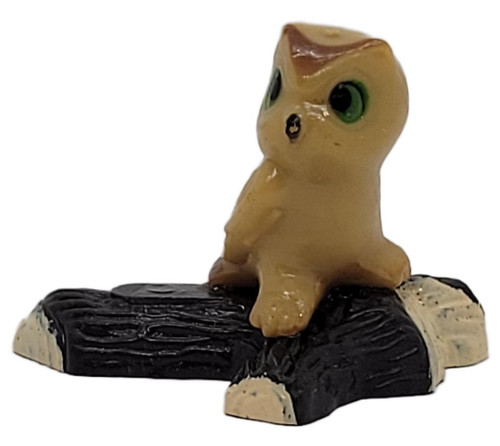 Draben's Toyland Vintage Hard Plastic Owl Figurine on Tree Log Green Eyes Made in Hong Kong – 1.5" Tall, tan owl with large green eyes perched on a textured dark tree log against a white background.