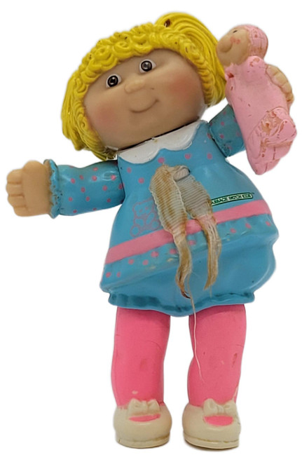 Cabbage Patch Kids 1984 Cabbage Patch Kids Poseable Rubber Girl Figure Blonde Hair Blue Dress 3.5", vintage poseable rubber girl figure with curly blonde hair, a blue dress with pink accents, pink pants, and a small pink doll accessory, shown against a white background.