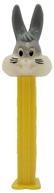 PEZ Vintage Bugs Bunny PEZ Dispenser Version A Off-White Face Yellow Footed Hungary, front view of a vintage yellow dispenser with Bugs Bunny’s off-white face and tall gray ears on a white background.