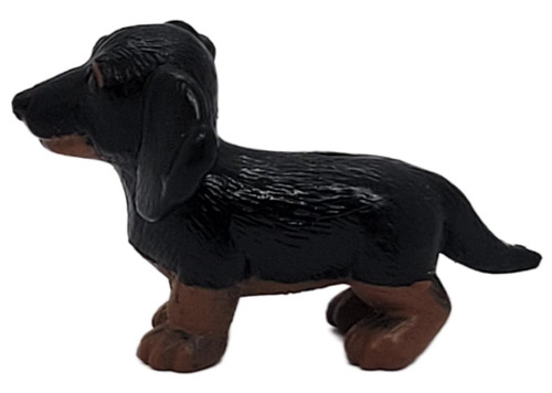 MEG 1995 MEG Puppy in My Pocket Herman Dachshund Dog Mini Figurine Vintage, small black and brown dachshund figurine shown standing in profile against a white background.