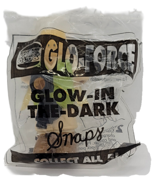 Burger King Kids' Club Glow-in-the-Dark Snaps from the 1996 Glo-Force series of toys. The figure is wearing a safari suit that is tan with camera that contains another figure inside.