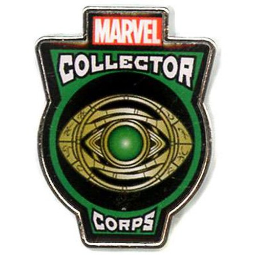 Funko pinback of Doctor Strange's Eye from the Marvel Collector Corps box. The eye is on a black background with a green outline. 