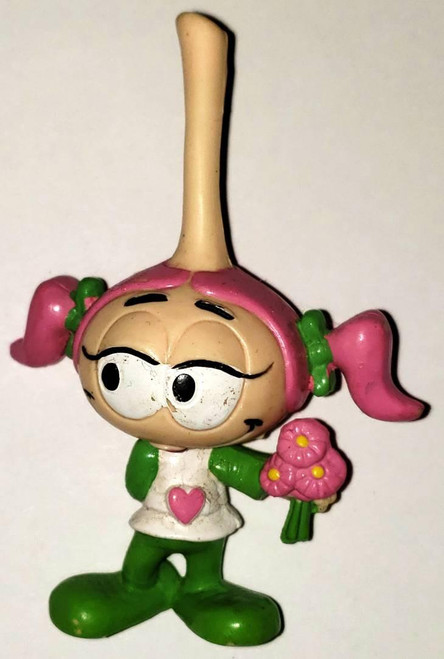 Snorks - Casey Holding Flowers, a toy figurine of a character with pink pigtails, large eyes, holding pink flowers, wearing green shoes and a white shirt with a pink heart.