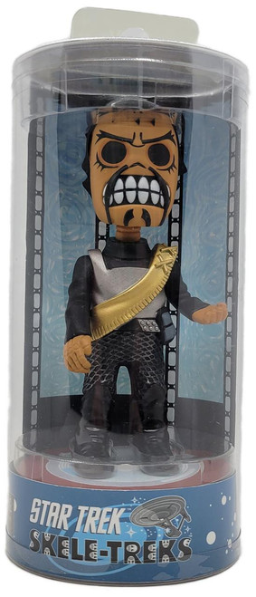 NECA 2013 Star Trek Skele-Treks Kor 5" Vinyl Figure, collectible toy in round plastic packaging featuring a stylized skeleton version of Kor from Star Trek, dressed in black and gray with a gold bandolier.