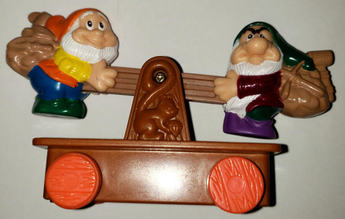 Disney Snow White And Seven Dwarves McDonald's Toy Figure, colorful plastic toy depicting two dwarf characters on a wooden cart.