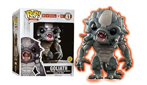 Funko POP! Games Evolve Goliath Glow In The Dark Toy Figure, grey monstrous creature with large eyes and open mouth, standing with a menacing posture alongside its box packaging.