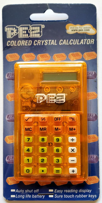 PEZ Colored Crystal Calculator, orange transparent calculator with digital display and rubber keys in packaging.