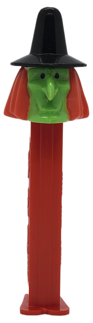 Vintage Halloween Witch D PEZ dispenser with green face, orange hair and black hat