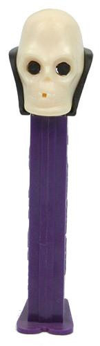 PEZ - Skull (Version B) Dispenser, toy with a skull-shaped head and purple base for dispensing candies.