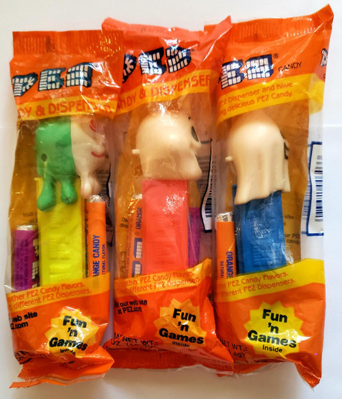 PEZ - Halloween Ghost (Happy Henry, Slimy Sid, Naughty Neil) Dispenser Set, featuring three ghost-themed PEZ candy dispensers in colorful packaging.