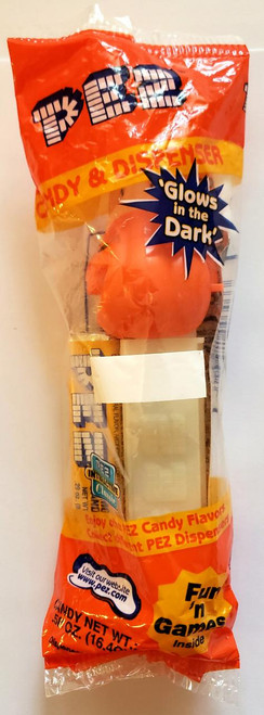 PEZ - Halloween Jack-O-Lantern GITD Stem Dispenser, glowing orange pumpkin-shaped candy dispenser for Halloween treats.