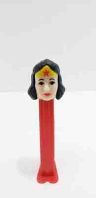 PEZ - DC Comics Wonder Woman Dispenser, plastic toy mock-up of Wonder Woman's face with a red dispenser base.