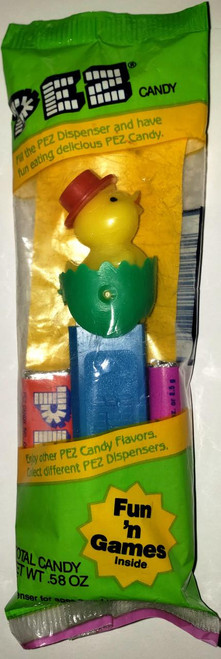 PEZ - Chick In Egg (Version B Pointy Green Shell) Dispenser, yellow chick figurine with a red top hat emerging from a green egg-shaped shell in a green and yellow PEZ candy packaging.