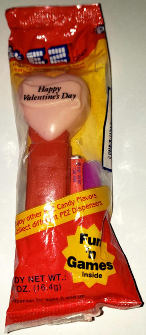 PEZ Pink Heart/ Red Stem 'Happy Valentine's Day' Pez Dispenser packaging, with a pink heart-shaped dispenser and candy inside.