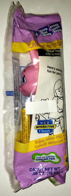 PEZ Mrs Easter Bunny F Pez Dispenser, partially visible pink bunny-shaped candy dispenser inside packaging.