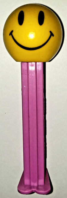 PEZ Walmart Smiley Funky Face on Purple Stem Pez Dispenser (Loose), a yellow smiley face character with black eyes and a wide smile on a pink stem dispenser.
