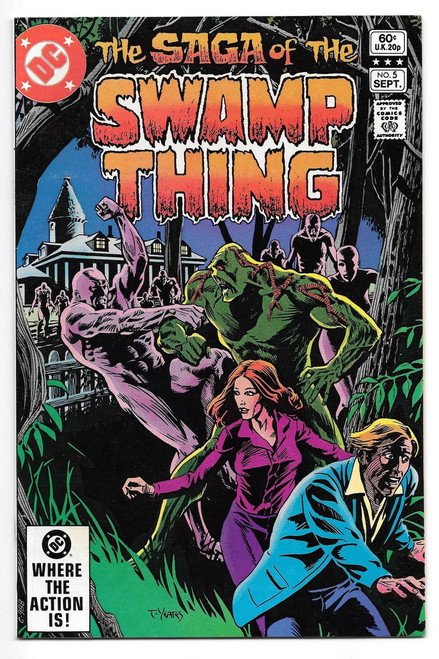 DC Comics Saga of the Swamp Thing Issue #5 comic book cover featuring Green Swamp Thing battling humanoid monsters with a woman and a man in foreground, spooky house in background, and dark forest surroundings.