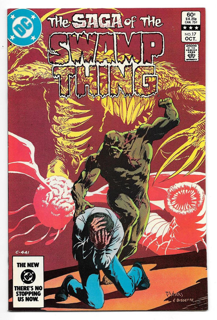 DC Comics Saga of the Swamp Thing #17 Comic Book, cover illustration showing a monstrous swamp creature with large claws and sharp teeth, standing behind a terrified man who is kneeling and covering his face with his hands.