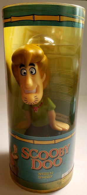 Scooby-Doo Wigglin Shaggy Figure, plastic toy figure of Shaggy from Scooby-Doo inside a cylindrical packaging container with colorful label.