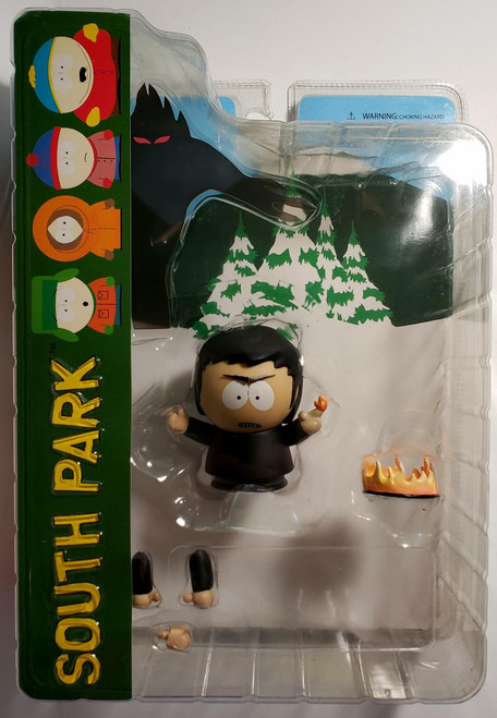 South Park Damien Action Figure, damaged package showing the character with black hair, black outfit, holding a small pumpkin, with additional accessories like a fire and disassembled limbs, inside a clear plastic casing.