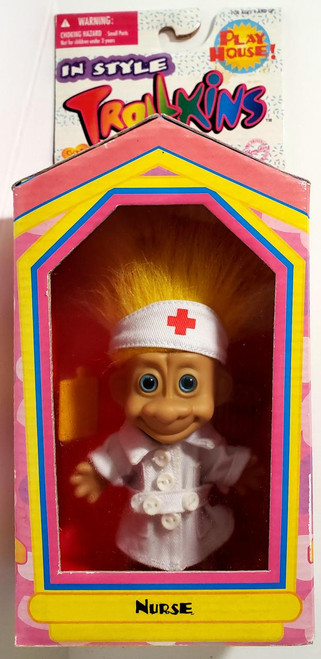 Original San Francisco Toymakers Trollkins - Nurse with Yellow Hair Toy Figure, toy doll dressed as a nurse with yellow hair, wearing a white nurse outfit and cap with a red cross, in colorful packaging with pink, yellow, blue, and purple accents.