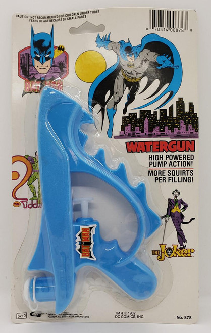 DC Comics 1982 Batman Watergun, colorful plastic water gun featuring Batman branding and comic-style artwork on the packaging.
