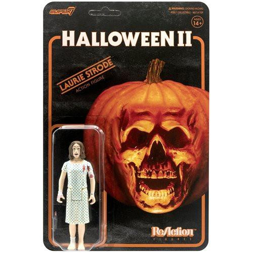 Super7 Halloween II ReAction Figure - Laurie Strode, action figure of Laurie Strode in a polka dot dress in front of a Halloween-themed packaging with a large pumpkin with a skull face.