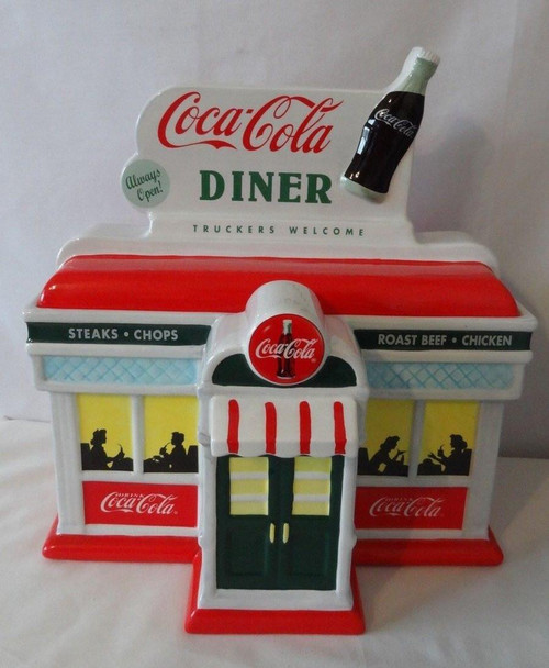 Coca-Cola Diner Cookie Jar, vintage ceramic cookie jar designed like a classic Coca-Cola diner building with a soda bottle on the roof.