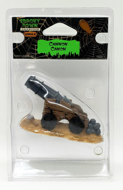 Lemax Spooky Town Cannon, miniature cannon model in Halloween themed packaging, collectible Halloween town accessory.