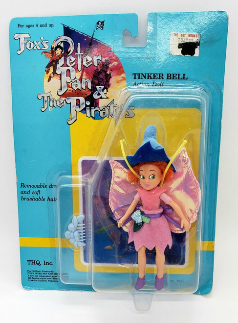 Product THQ, Inc. Fox's Peter Pan & The Pirates - Tinker Bell Action Doll, vintage Tinker Bell doll with removable dress and soft, brushable hair in original packaging.