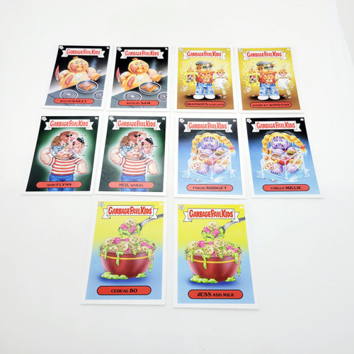 Garbage Pail Kids GPK Bizarre Holidays March Week 1 Base Sticker Set, colorful collectible stickers featuring quirky characters and holiday themes.