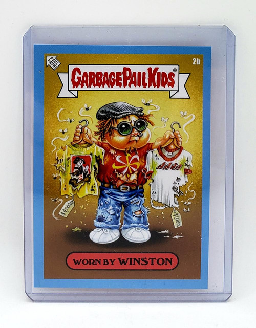 Garbage Pail Kids 2021 GPK Bizarre Holidays March Week 1 Blue Parallel - 2B Worn By Winston, collectible trading card featuring a cartoon character Winston holding tattered T-shirts, with a yellow background and cartoon flies.