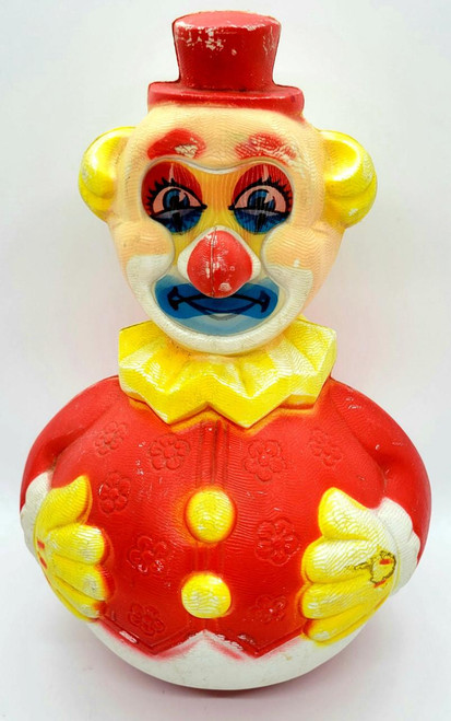 Vintage Clown Roly Poly Toy, colorful clown figurine with a red hat, yellow hair, blue face, red nose, and a red and yellow outfit with floral designs.