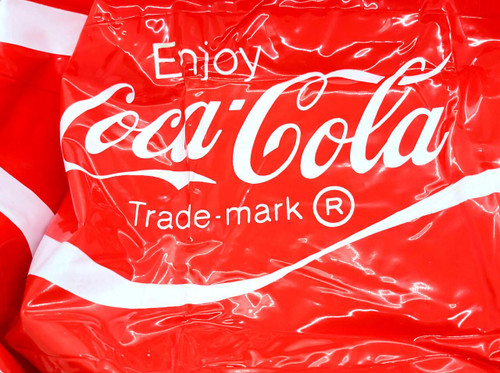 Coca-Cola Vintage 'Enjoy' Coca-Cola Beach Ball packaging, vibrant red with white logo and design.