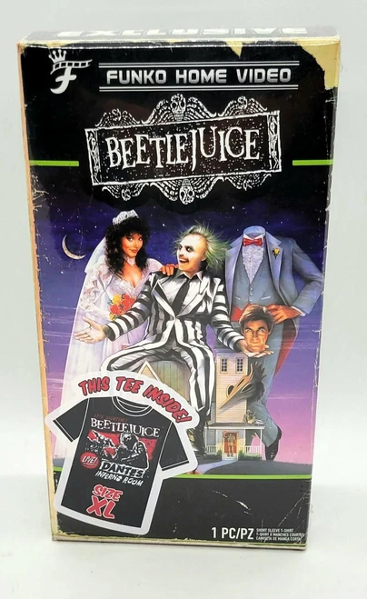 Funko Home Video Beetlejuice T-shirt (Size XL), packaging box featuring characters from Beetlejuice movie, with a spooky house and night sky in the background.