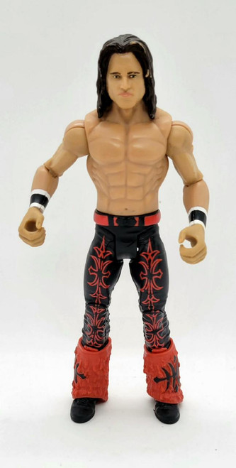 WWE 2010 John Morrison Action Figure (Loose), plastic action figure of John Morrison with detailed facial features, muscular torso, black pants with red tribal patterns, red furry boots, and arm bands, standing against a plain background.