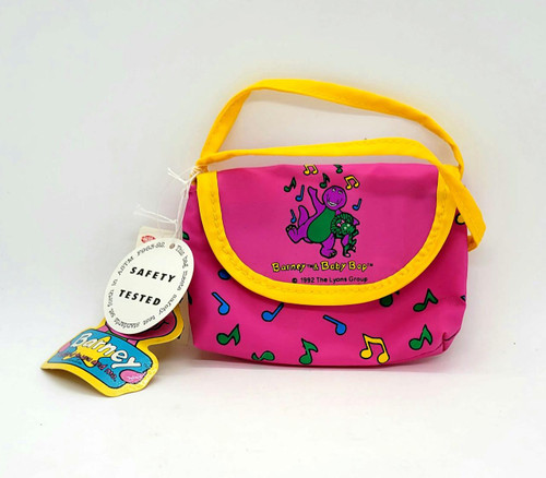 The Lyons Group Vintage 1992 Barney and Baby Bop Change Purse, pink fabric with colorful music notes and a yellow trim, featuring cartoon characters Barney and Baby Bop on the front.