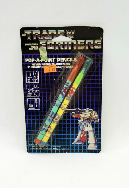 Transformers Vintage 1985 Transformers Pop-A-Point Pencils, set of two colorful pencils with Transformer character designs in original packaging.