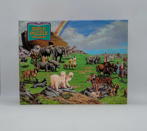 Bible Puzzle - Noah's Ark 2 100 Piece Jigsaw Puzzle, colorful illustration of Noah's Ark with various animals and people on a grassy landscape