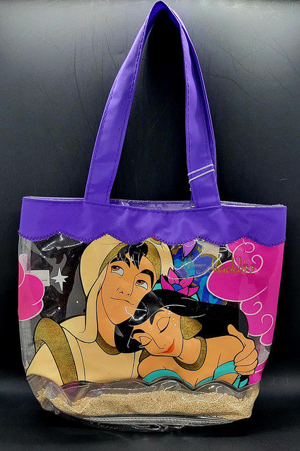 Bring the magic of Disney's Aladdin into your child's adventures with this enchanting kids tote, perfect for beach days or playdates!

This clear plastic tote not only sparkles with fun but also features sandy designs at the bottom, making it the ideal companion for young Aladdin fans. The included purple sunglasses add an extra touch of style while protecting their little eyes from the sun.