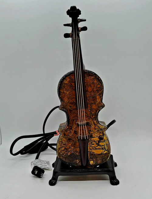 Unbranded Glass Violin 12-inch Table Lamp, decorative lamp shaped like a violin with a textured amber-colored glass body and black accents, on a black stand.