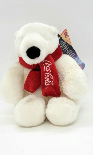 Boyds Bears Coca-Cola Polar Bear 6" Stuffed Animal, white plush toy with a red scarf that has the Coca-Cola logo embroidered on it.