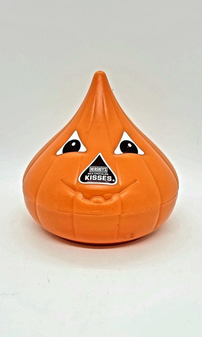 Hershey's Kisses Halloween Jack-O-Lantern Candy Container, orange pumpkin-shaped container with a spooky face and Hershey's logo.