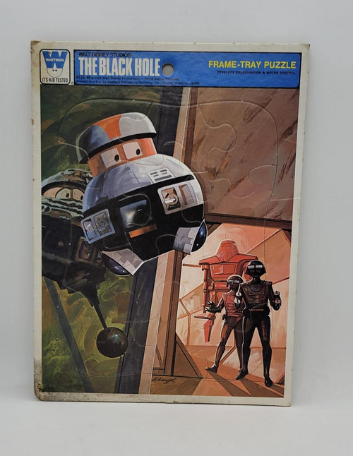 Disney's The Black Hole 4520-4B Frame-Tray Puzzle, vintage illustrated puzzle box featuring a robot spaceship and two humanoid robots in a sci-fi setting.