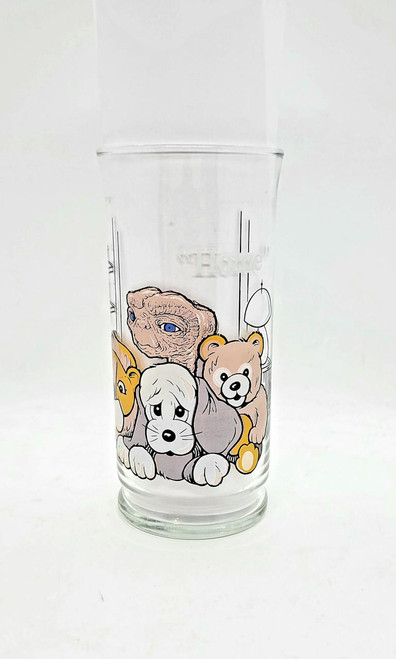 E.T. Pizza Hut 1982 E.T. 'Home' Collector Series Tumbler, a clear glass tumbler featuring characters from the E.T. movie in a colorful cartoon style.