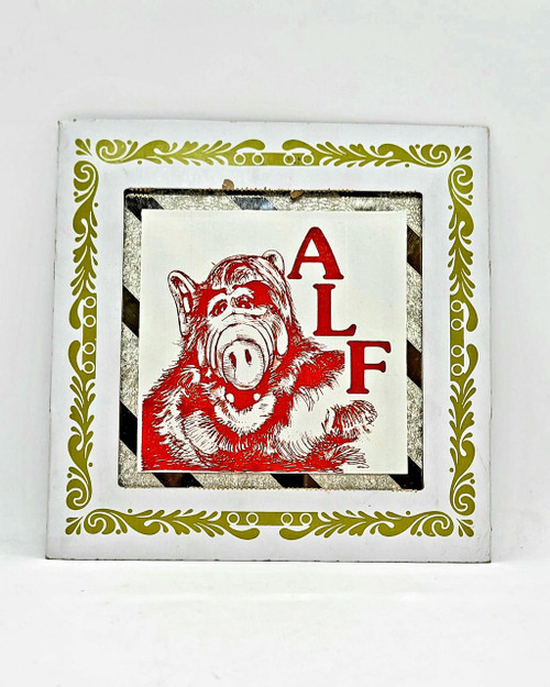 ALF Carnival Glass Mirror Tile With Case, decorative mirror tile with a mirror case featuring a red design of a pig with the word 'ALF' in red letters.